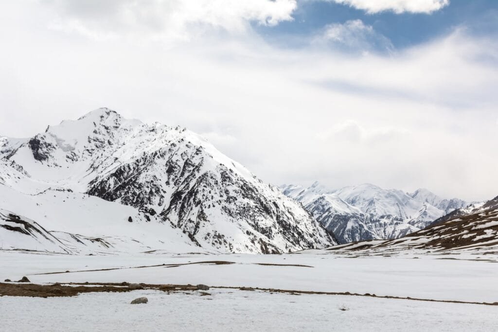 Trekkers crossing a high mountain pass in the Karakoram Range