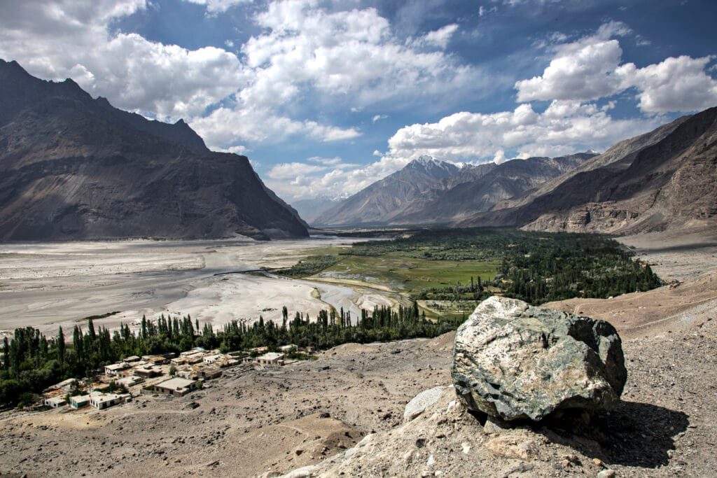 Green fields and poplars of the Shigar Valley beneath Karakoram peaks