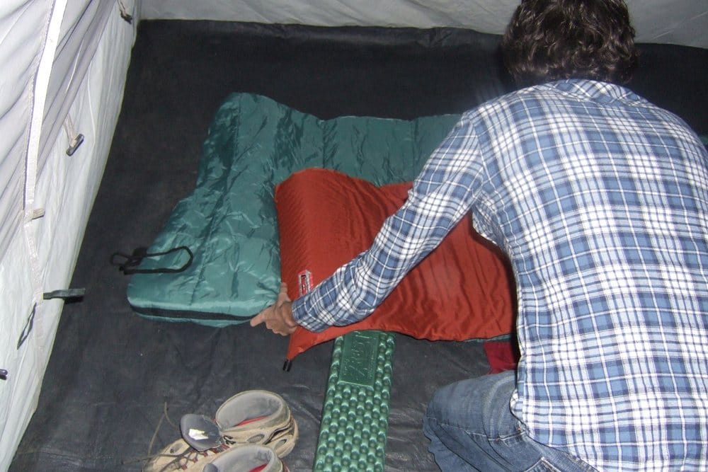 Sleeping bag inside a tent at a high camp