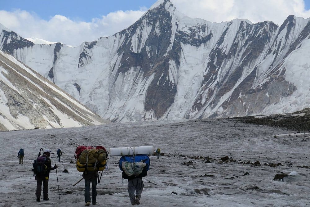 Porters carrying gear on a Karakoram trail