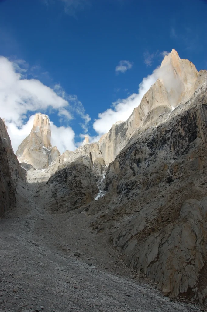Great Trango Tower and the sharp spire of Nameless Tower rising above the Baltoro Glacier in the Karakoram