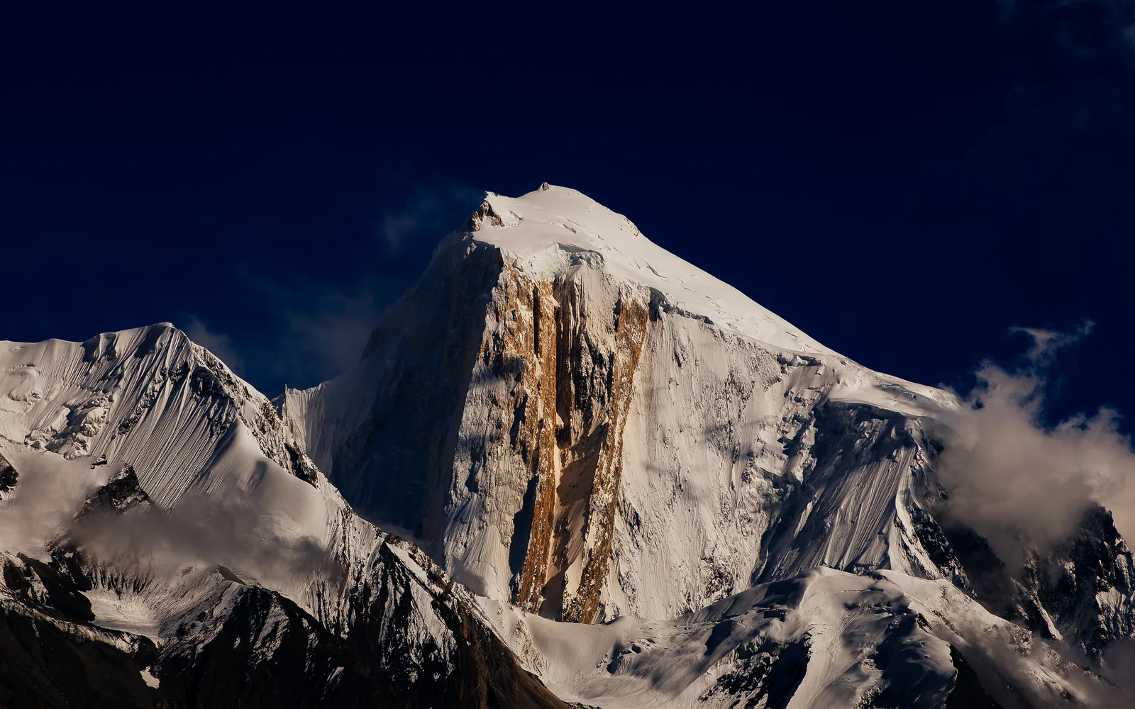 The Golden Pillar of Spantik (7,027 m), a wall of creamy marble on the northwest face catching the morning sun in the Karakoram