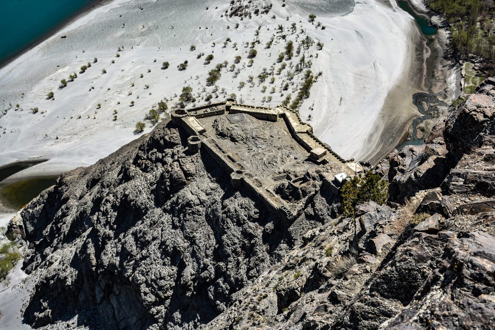 Aerial view of Kharpocho Fort perched on a rocky spur above Skardu town and the Indus River