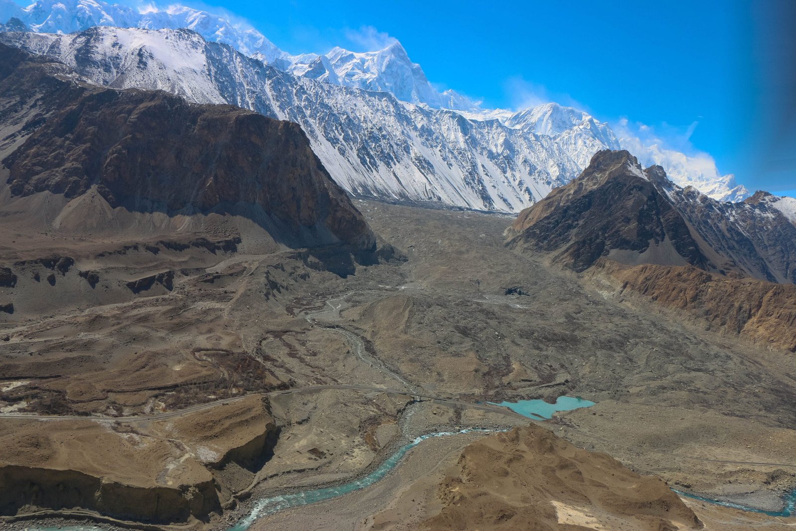 Snout of the Batura Glacier overshadowing the Karakoram Highway near Passu