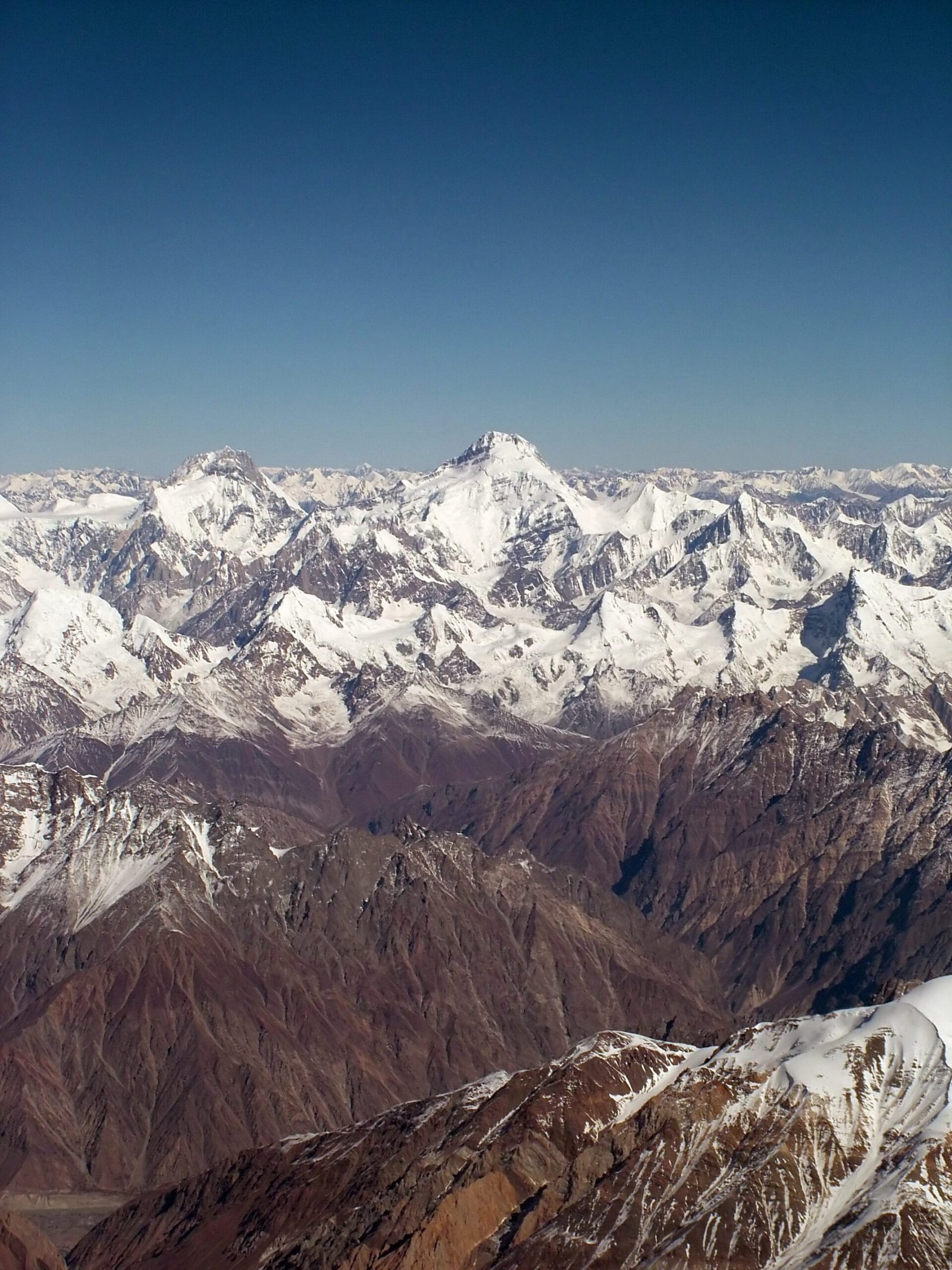 Aerial view of Kanjut Sar (7,760 m) and Yukshin Gardan Sar in the Hispar Muztagh, Karakoram