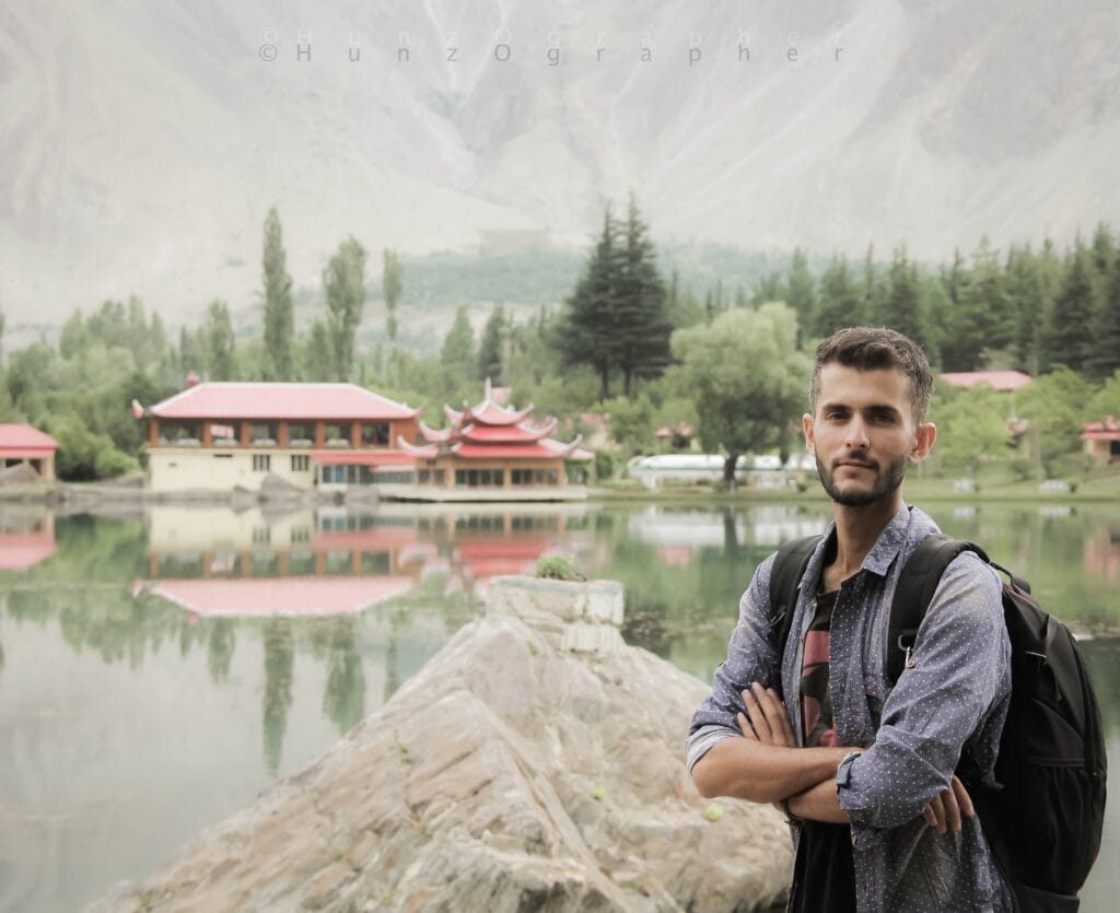 Lower Kachura Lake and the Shangrila Resort cottages reflected in still water near Skardu