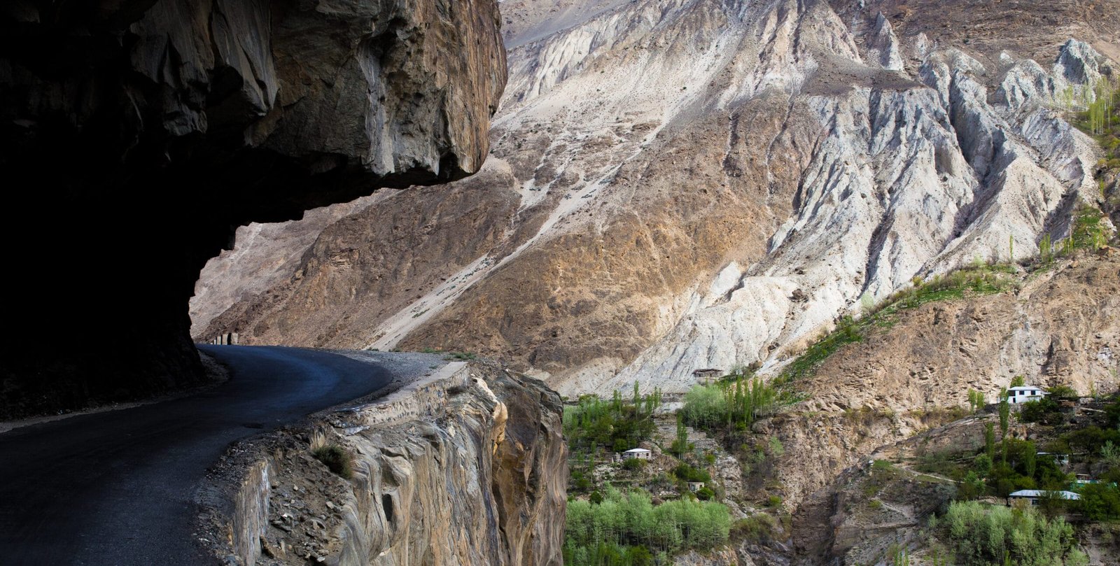 The Karakoram Highway road winding through Gilgit-Baltistan mountains
