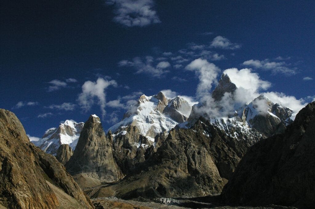 Baintha Brakk (The Ogre) and Ogre II rock spires rising above a Karakoram glacier