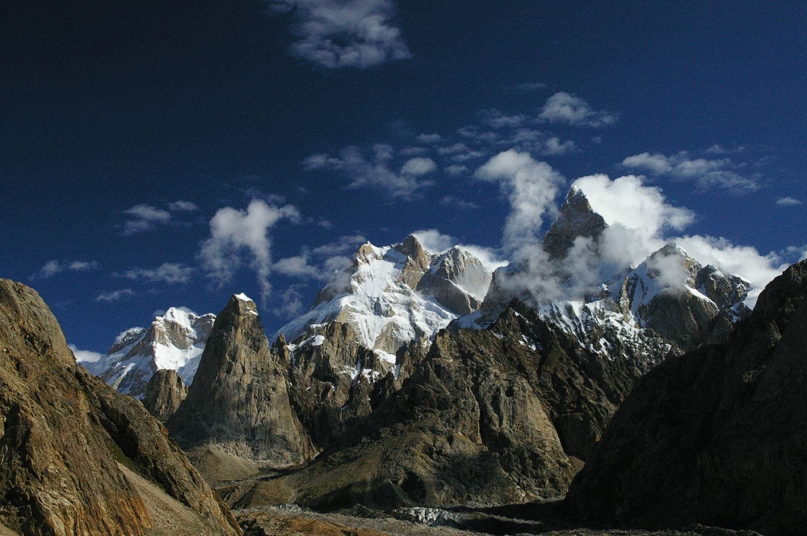 Baintha Brakk (The Ogre) and Ogre II rock spires rising above a Karakoram glacier
