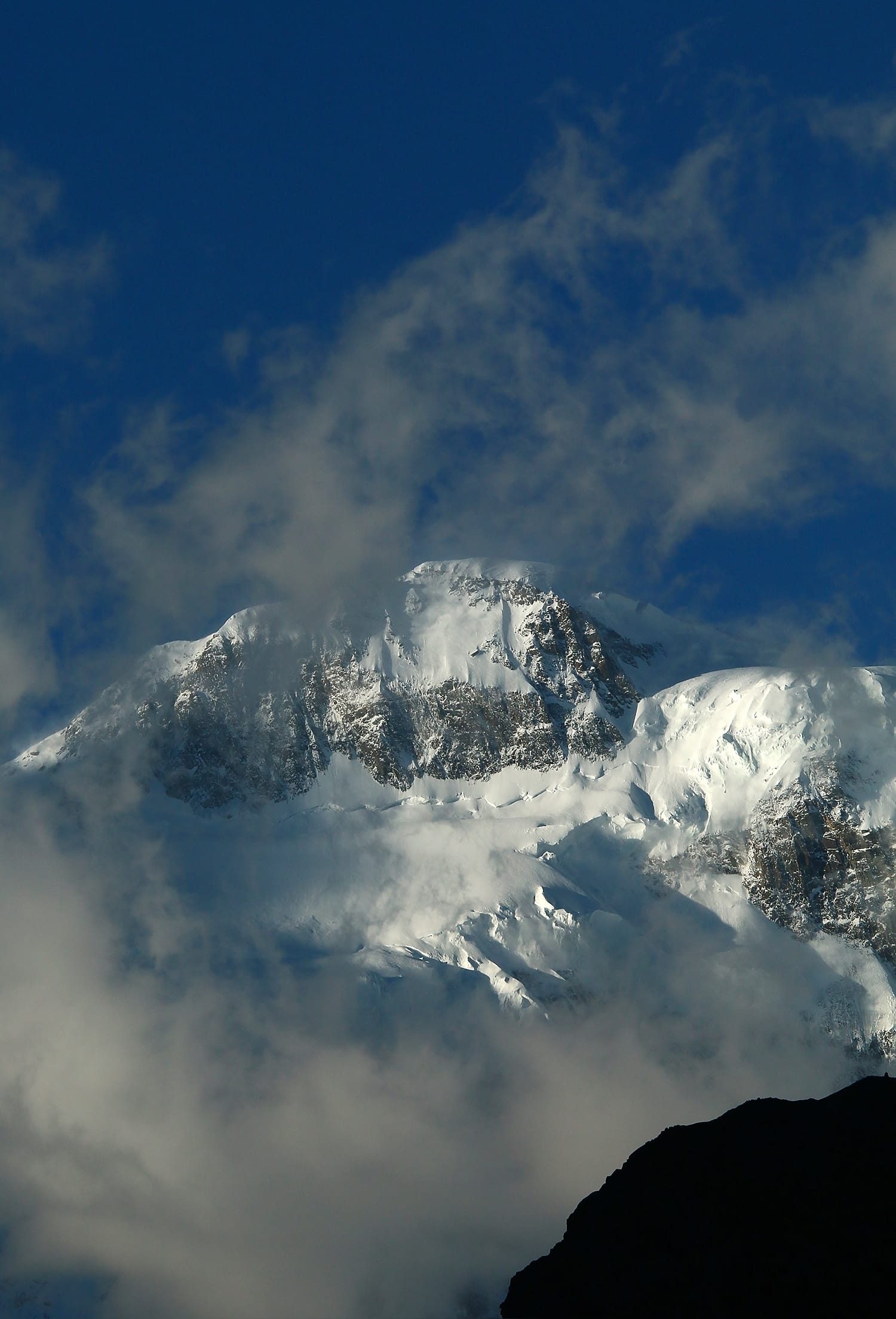 Passu Sar, 7,478 m, seen above the Hunza valley in the Batura Muztagh