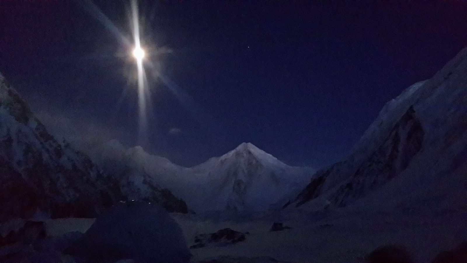 Sia Kangri (7,422 m) at night in the Karakoram, flanked by Baltoro Kangri and Gasherbrum I
