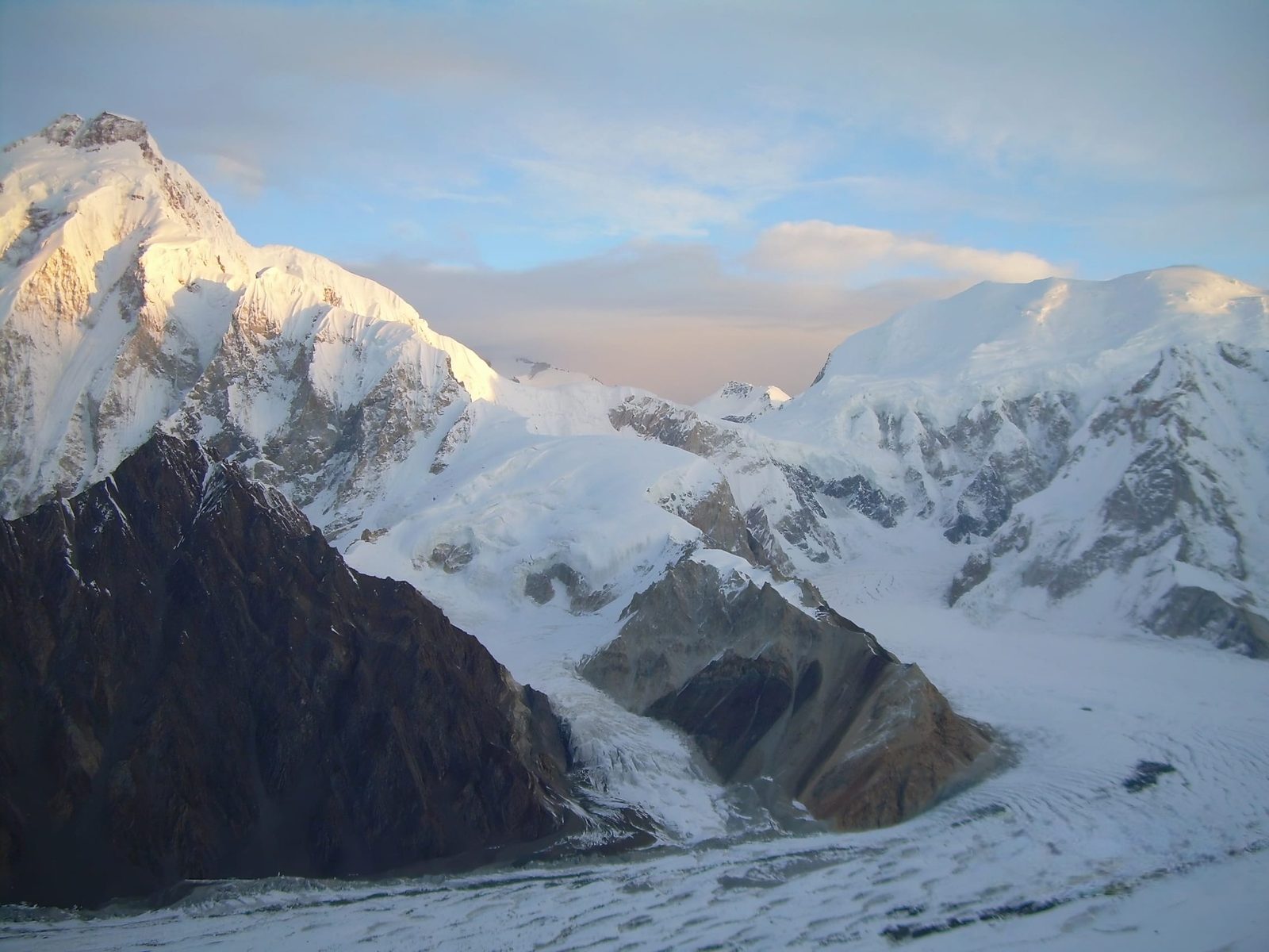 South faces of Baltoro Kangri on the left and Sia Kangri on the right, joined by the Conway Saddle