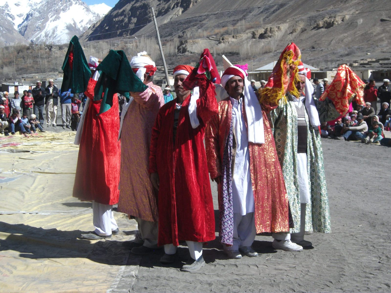 Pack animals and people crossing the Shimshal valley on an old caravan route