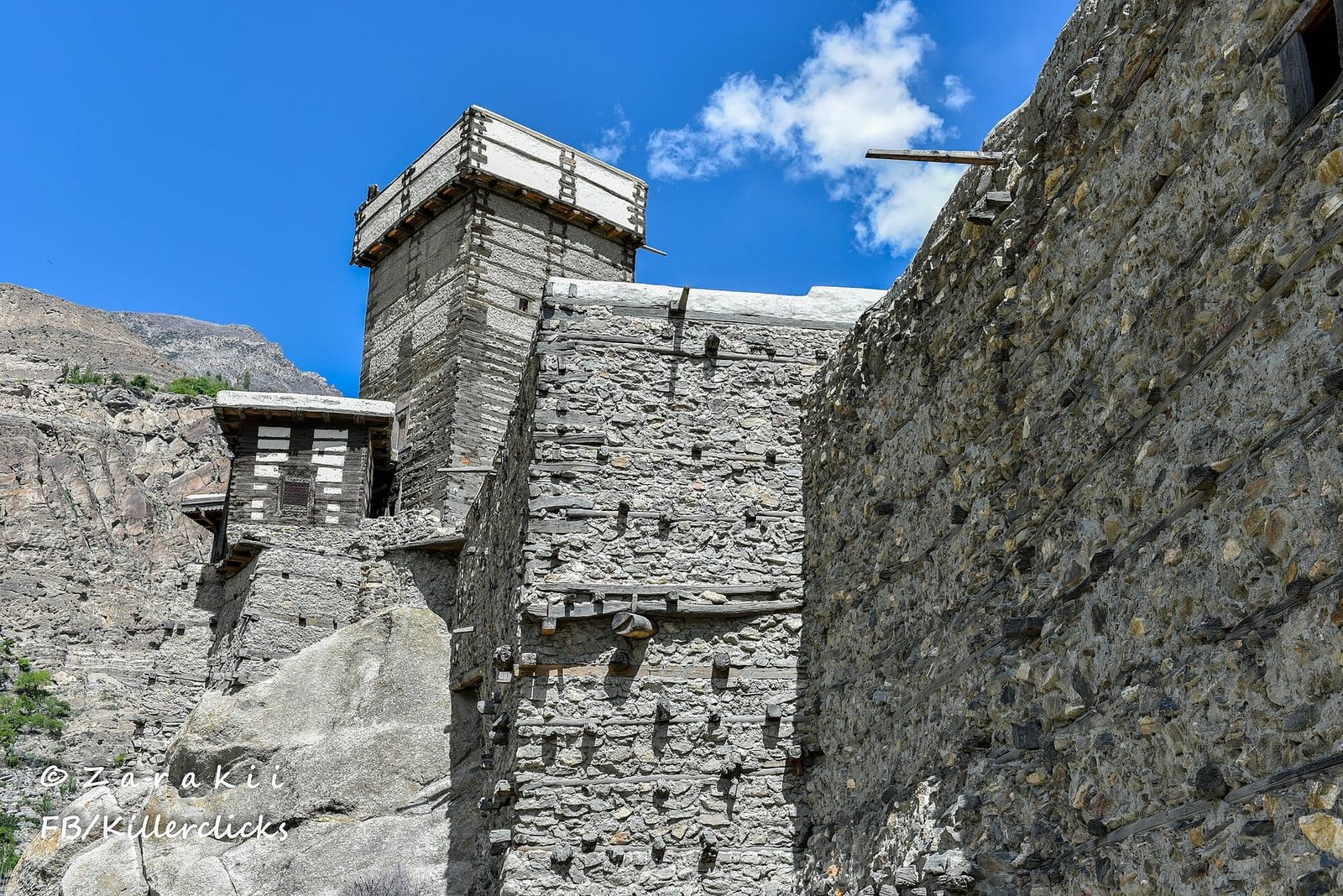 Altit Fort and its stone and timber Shikari tower on a rock above the Hunza river