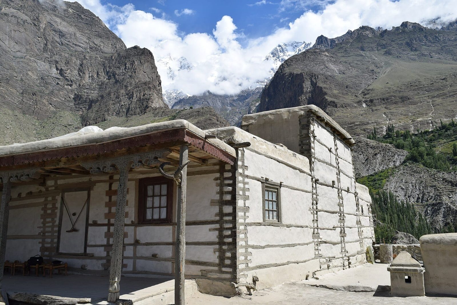 Baltit Fort standing above Karimabad in the Hunza valley with Ultar Sar rising behind it