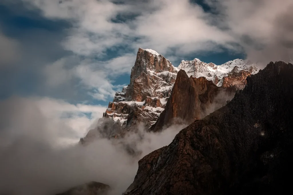 Granite spires rising through drifting cloud in the Karakoram