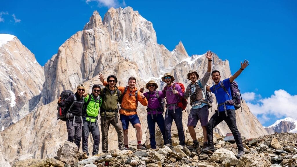 Trekking group celebrating below the Trango Towers on the K2 Base Camp trek