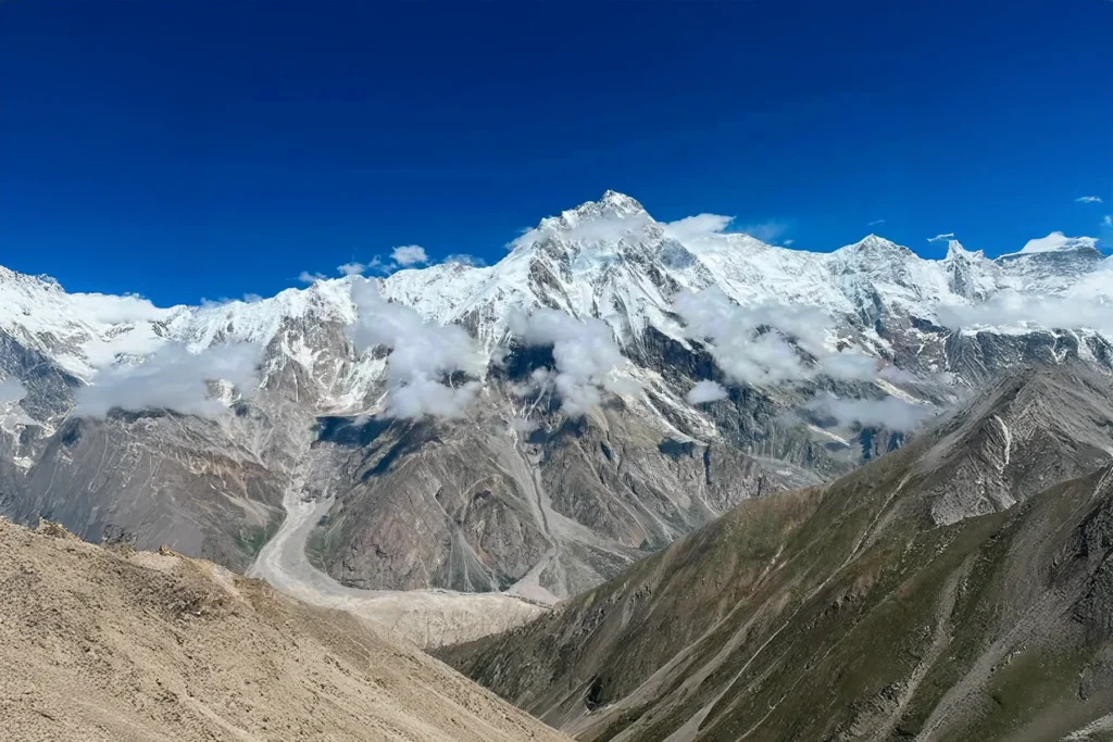 Summer cloud banner streaming off a Karakoram snow massif